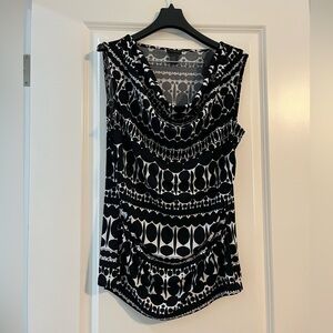 Ann Taylor size M black and white cow neck top. Flattering sides